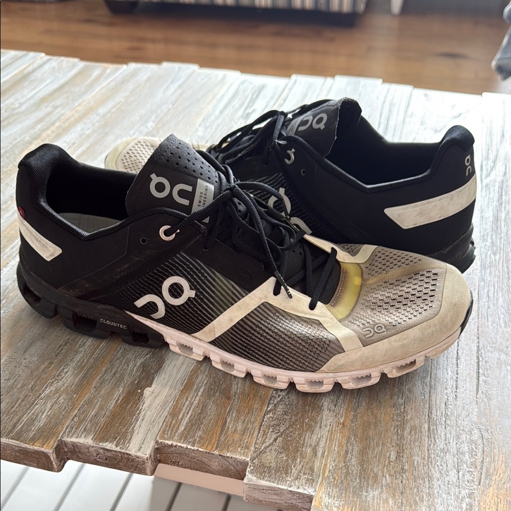 On Running Black and White Athletic Shoes with Cushioned Sole